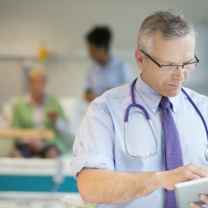 doctor checking notes